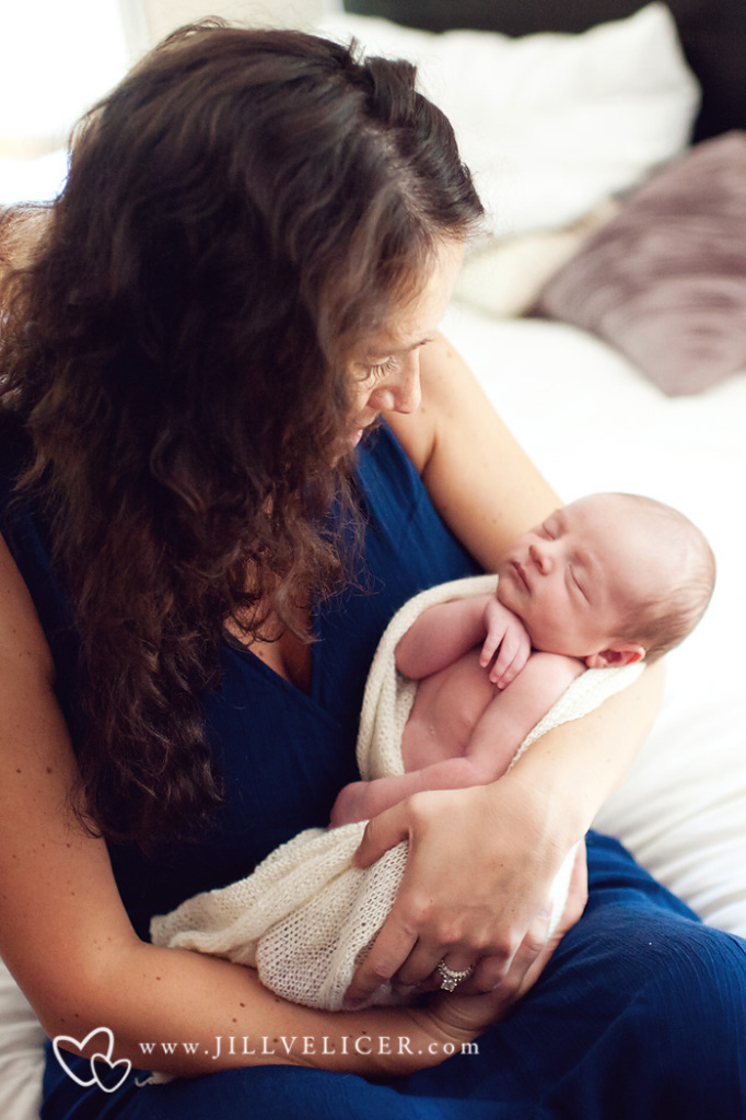 mother looking at newborn